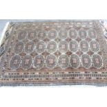 Afghan rug, the three rows of eight gols and multiple borders on a washed wine, blue and beige