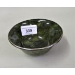 20th Century Chinese spinach green jade bowl with white metal mount, 10cms diameter