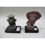 Two pre-Columbian terracotta figures of seated females with headdresses