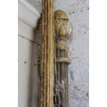 Two gilt patinated wooden curtain poles There are some losses to finish on both poles and no