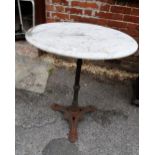 Cast iron and marble topped garden table (top at fault), 60cms diameter