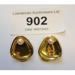 Pair of 14ct gold shell form earclips, set with single pearls, marked 585 Weight - 2.7g