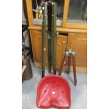 Early 20th Century red painted tractor seat, together with a military adjustable green painted