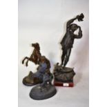 Dark patinated spelter figure of a sailor, 53cms high including plinth base, together with two