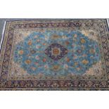 Indo Persian carpet with a medallion and all-over stylised design on a sky blue ground with corner