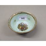 Small Wedgwood blue lustre bowl internally decorated with a dragon, 10cms diameter x 5cms high In