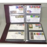Two albums containing a collection of various First Day covers and a quantity of various