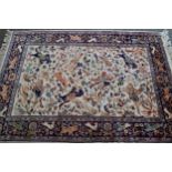 Modern Indo Persian rug with an all-over hunting design on an ivory ground with borders, 180cms x