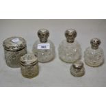 Pair of silver mounted and cut glass ball form perfume bottles, 11cms high together with four