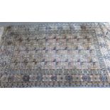 Turkoman rug, the three rows of gols and multiple borders, on a faded red ground, together with