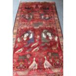 Modern Gabbeh rug with an all-over animal, bird and pictorial design on a red ground with borders,