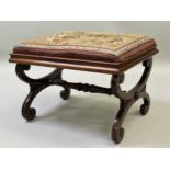 Victorian rectangular stool with a needlepoint seat on shaped end supports with stretcher, 67cms