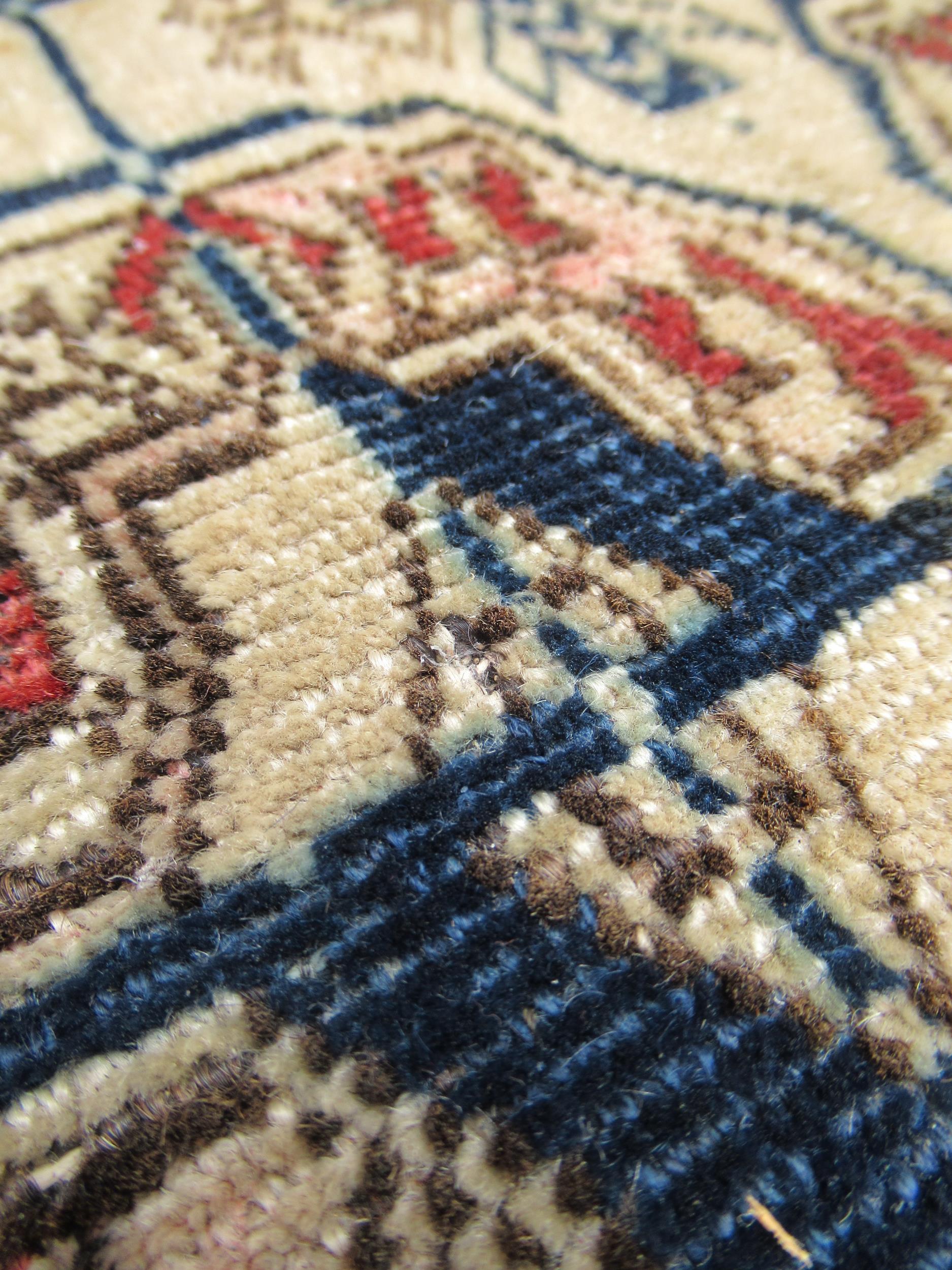 Turkoman rug, the three rows of gols and multiple borders on a washed beige, red and blue ground, - Image 10 of 21