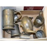 Large antique pewter tankard, five other various tankards and a pewter teapot