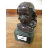 Small bronze bust of a young girl on green flecked marble base, indistinctly signed in the bronze,