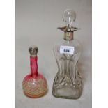 Silver mounted cut glass decanter and a cranberry and clear glass silver mounted perfume bottle,