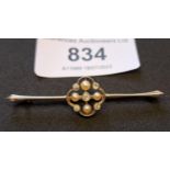 Edwardian white and yellow metal bar brooch set five small diamonds and four split pearls, 50mm