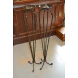 Pair of wrought iron floor standing candle stands