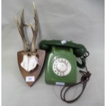 Green mid 20th Century telephone and a pair of small mounted deer antlers