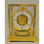 Jaeger-LeCoultre Atmos clock, the gilt brass four glass case enclosing a white dial with Arabic