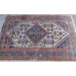 Hamadan rug, the central hooked medallion on cream, red and blue ground (with wear), 147cms x 102cms