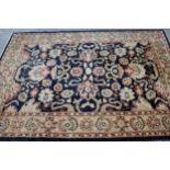 Modern Afghan rug of Ziegler design with a palmette pattern on a dark blue ground, with beige and