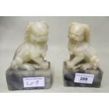 Pair of Chinese carved soapstone scroll weights in the form of temple dogs, 12.5cms high