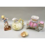 Four early Royal Worcester items an elephant, a jug, seated figure and a small basket (some cracks)