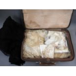 Small brown case containing a quantity of various antique linen, crochet work and other lace edges