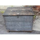 Small 19th Century stained pine trunk with a hinged cover and two iron side handles, 64cms x 47cms x