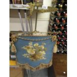 Victorian silk and woolwork face screen on adjustable gilt brass bracket with clamp, 50cms x 49cms