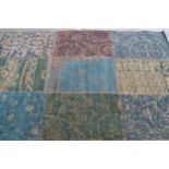 Modern flatweave patchwork rug in shades of dark green and teal, 200cms x 140cms
