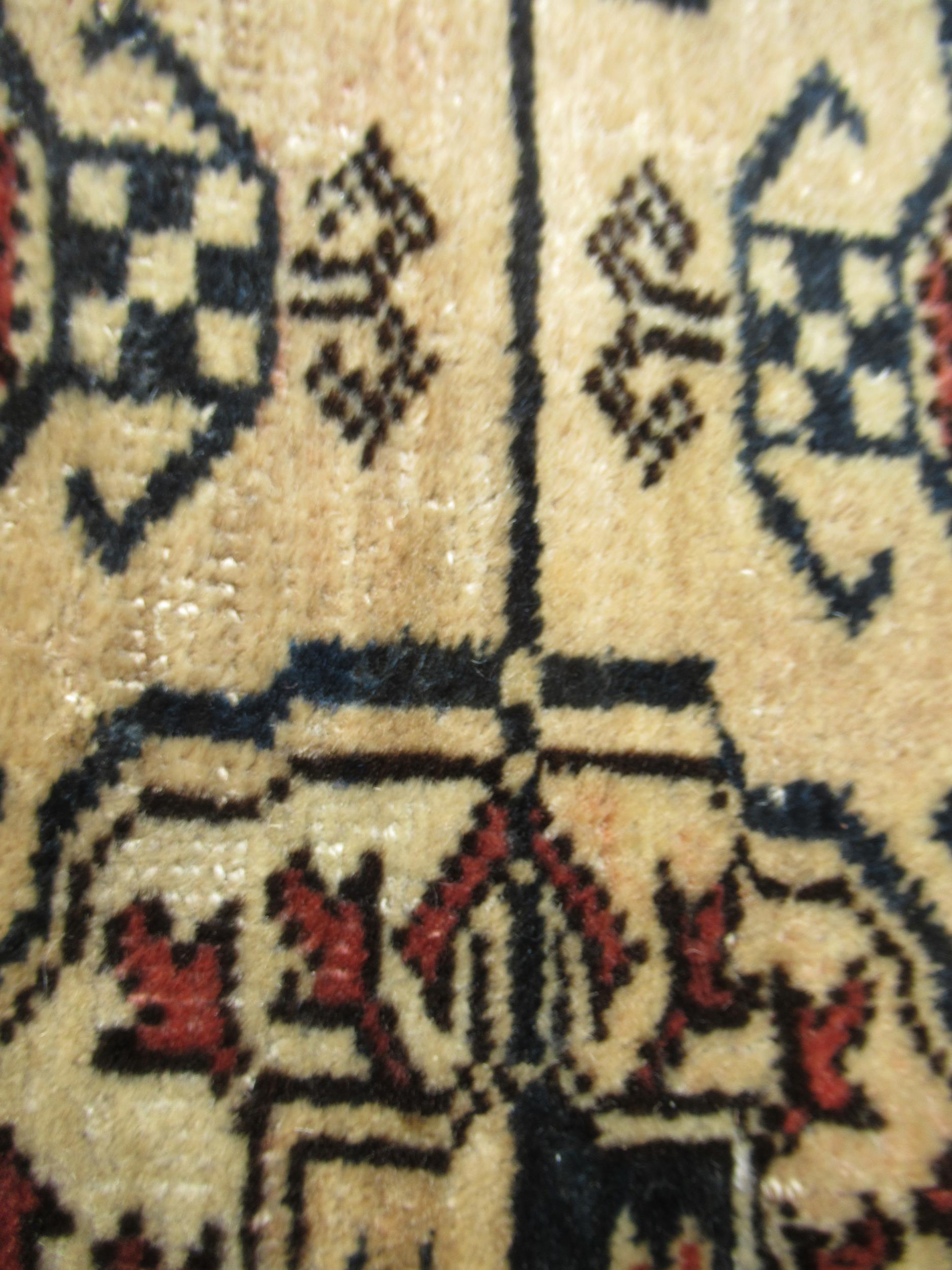 Turkoman rug, the three rows of gols and multiple borders on a washed beige, red and blue ground, - Image 16 of 21