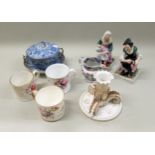 19th Century porcelain candlestick (at fault), pair of Staffordshire pottery figures, cobbler and