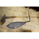 Antique iron trenching tool with wooden handle, together with an iron and wooden hay cutter