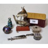 Small white metal model of a boat on stand, three white metal and enamel decorated items, another