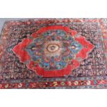 Small antique Bidjar rug with a medallion and a plain design, with Herati corner designs and