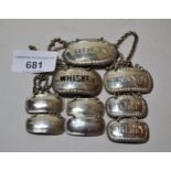 Set of four Victorian silver decanter labels for sauce and vinegar, pair of similar Sherry and