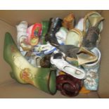 Box containing a collection of various porcelain and glass ornaments of shoes
