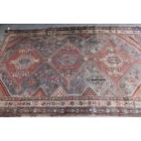 Antique Qashqai rug with a triple medallion and all-over design with borders, 242cms x 155cms