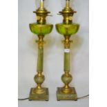 Pair of mid 20th Century table lamps in the form of oil lamps, each with a glass chimney, green