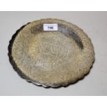 Egyptian silver circular dish with all over decoration in arabic text, having three character mark