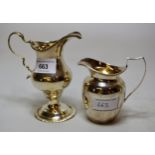 George III silver pedestal cream jug together with a Birmingham silver cream jug of plain baluster