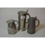 Tudric pewter hot water pot with rattan handle, possibly Archibald Knox together with a similar,