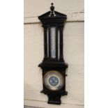 Late 19th / early 20th Century carved and ebonised barometer / thermometer with painted dials,