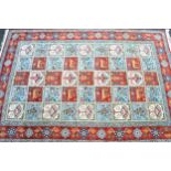 Tabriz all-over tile pattern rug in shades of brick red, pale blue and cream, 205 x 135cm
