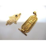 Two Middle Eastern yellow metal pendants, 5.5g