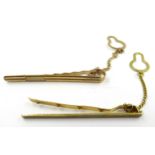 Two 9ct gold tie clips with safety chains, 4.6g