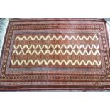 Good quality Turkoman rug with two rows of linked gols on an ivory ground with multiple narrow