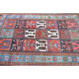Bakhtiari rug with an all-over garden panel design and rosette borders, 250 x 158cm